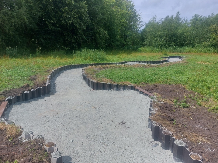 Area shows a sunken pathway being built into the ground